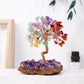 Colorful crystal tree on a rock base with a white background