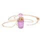 Necklace with a pink crystal pendant on a white background