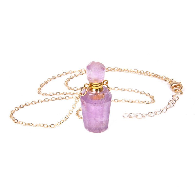 Necklace with a pink crystal pendant on a white background