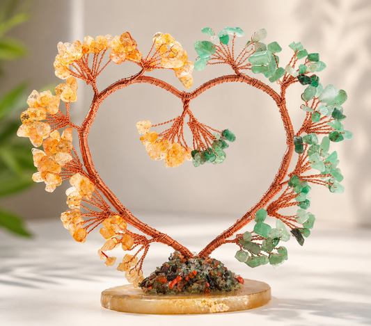 Decorative heart-shaped sculpture with orange and green elements on a neutral background