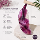 A translucent purple fluorite feather crystal sculpture displayed on a light stone pedestal, with product dimensions, weight, and material information printed on the left side of the image.