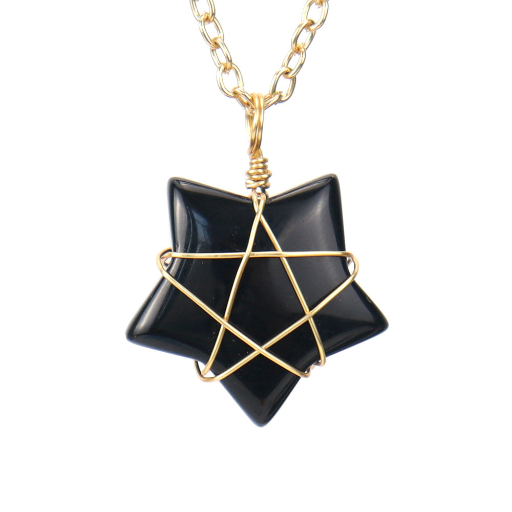 Black geometric pendant necklace with gold chain on a white background