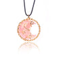 Pink moon-shaped pendant necklace on a white background