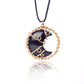 Black boot pendant with gold chain on a white background