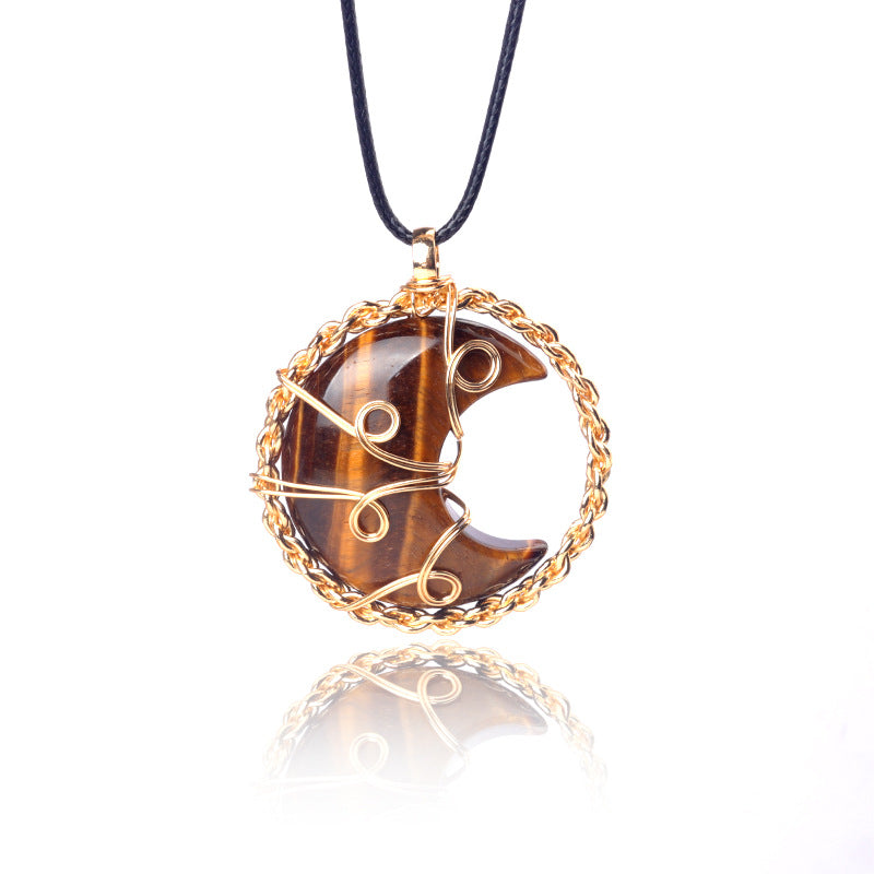 Tiger eye stone pendant with gold wire wrapping on a white background
